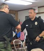 Corporal Mark Putnam is promoted in front of Town Council