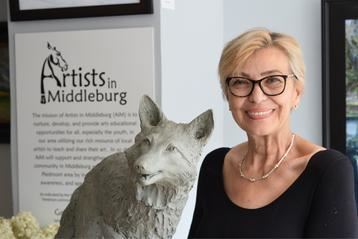Artist with Fox Sculpture