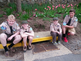 Boy Scout Troop Installing Medallions on Town Storm Water Drains